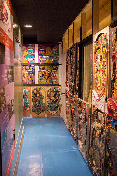 The corridor to the toilets is lined with playfields and backglasses