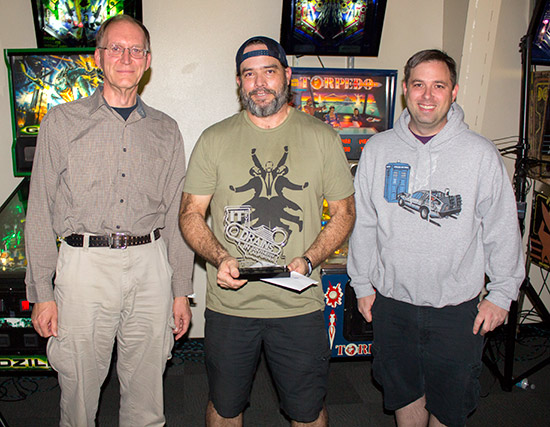 Keith receives his winner's trophy from Bob Matthews and Karl DeAngelo