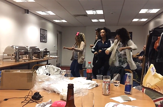 Dancers practicing their routine in the green room
