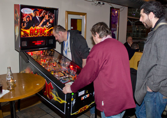 The AC/DC at the welcome party is played by Ad Jonker as Dom Escott and Oliver Moazzezi watch 