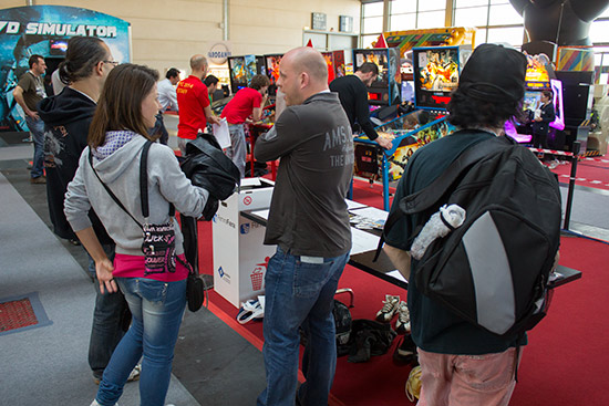 Players queue to get their turn on the five tournament machines