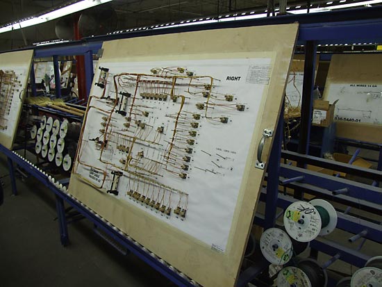 Wires are added to the cable loom