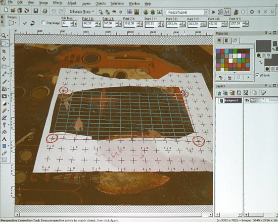 The damaged artwork is surrounded by the paper grid
