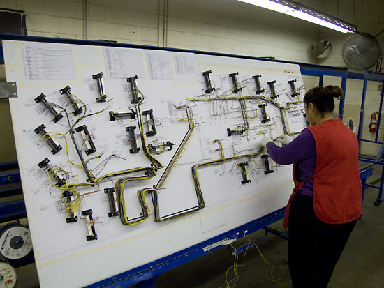 A cable loom being made