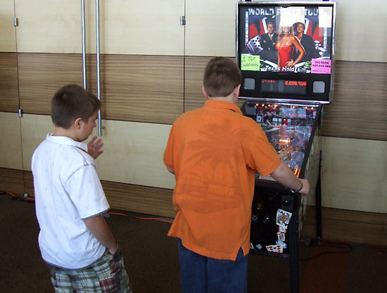 Andrew watches Joshua in as they play in the final of the Kids Division