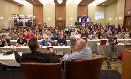 The audience listens and asks questions