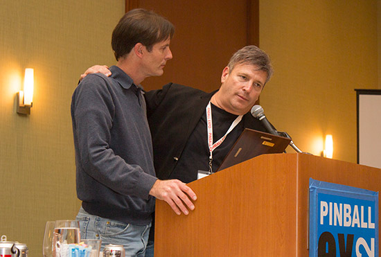 John receives his award from Joe