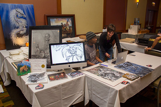 A little further in on the left side of the exhibit hall, artist Victoria Ren&eacute; had a stand selling artworks and printed T-shirts