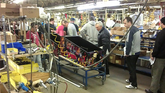 The decaled cabinet then goes down the line to be fitted with its hardware