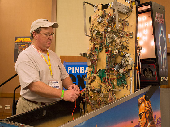 Chris Hibler takes a measurement on the Dirty Harry machine