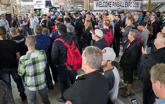 The Expo guests assemble inside the factory