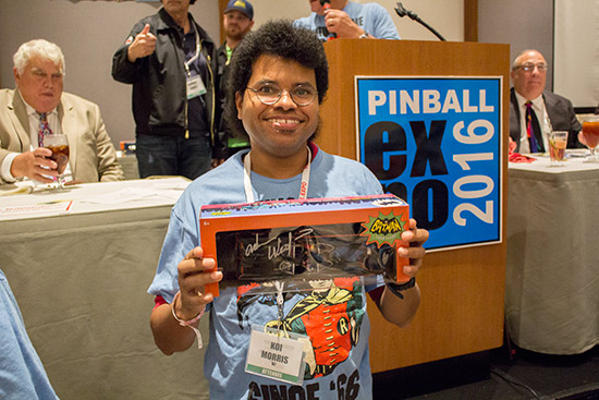 Koi wins a batman toy signed by Adam West