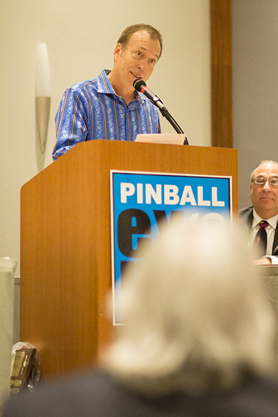 Connie Mitchell listens as Eugene reads his induction speech