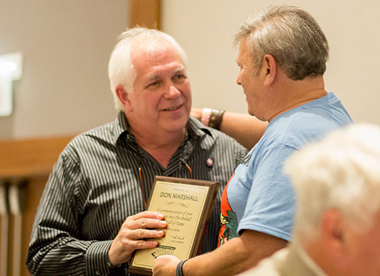 Joe inducts Don Marshall into the Pinball Expo Hall of Fame