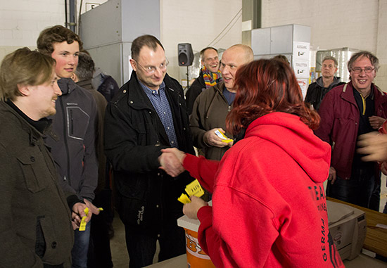 The lucky winner is congratulated