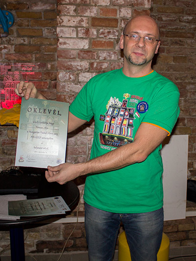 Gábor shows the third place certificate won by the absent Markus Stix