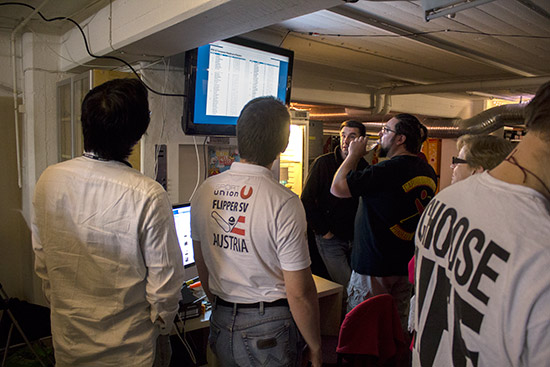 Players check their current standing on the monitor