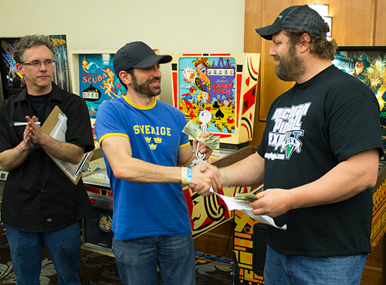 Zach receives his trophy and $1,000 prize