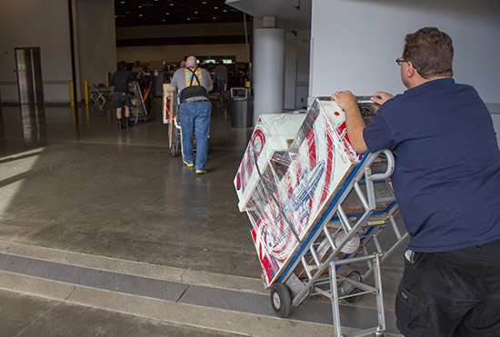 Games are wheeled into the hall