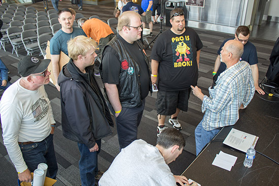 John talked to guests and signed their pinball items