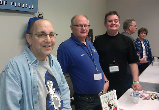Jim Schelberg of the Pingame Journal, Gary Flower and Steve Richie smile for the camera