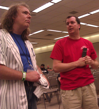 John Popaduik discusses tomorrow's seminar details with Mike Lorrain