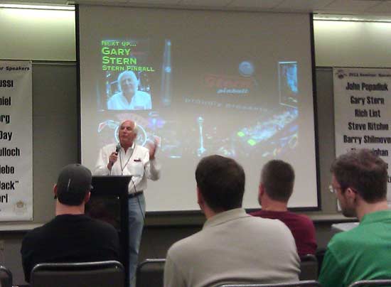 Gary Stern begins his Saturday seminar. You really could call this seminar "Manufacturing Pinball 101." You might also call it "Licensing 101" as he discussed the difficulties of and impossibilities of Stern creating a non-licensed theme. He says his people are begging him to create non licensed themes and he simply says "no." According to him, if he mentions a non licensed game to a European distributor they will say "send me 1 or 2 to try out" but if he mentions "Avatar" they immediately say "I'll take two containers full." He says it is just too risky for Stern to do a non licensed game.