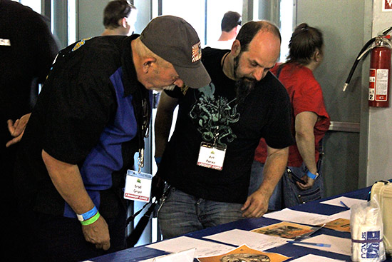 Brad Grant spends countless hours on this project. Here he is going over the silent auction sheets. 