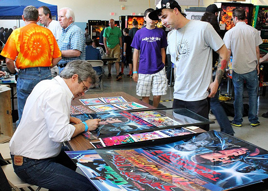 Doug Watson autographing a T2 translite