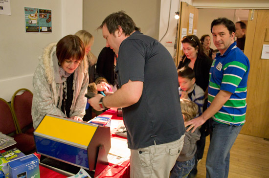 Slam organiser, Will Barber, does some last minute briefing of the desk staff