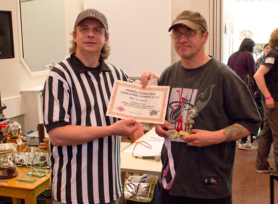 Darren presents Stan with his prizes
