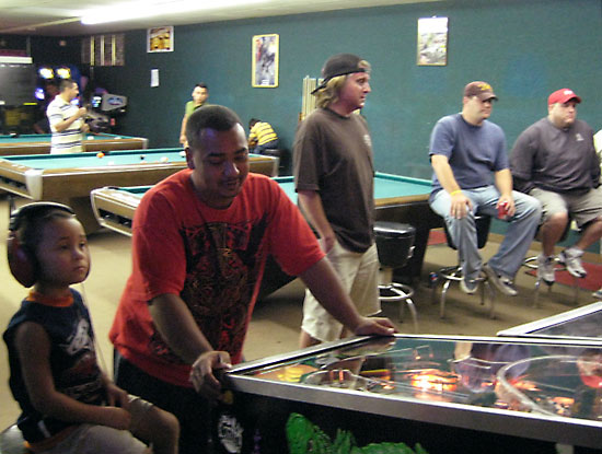 A few of the people enjoying pinball