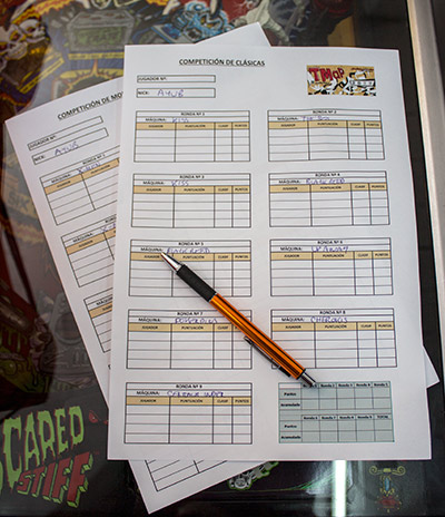 The two score sheets and pen