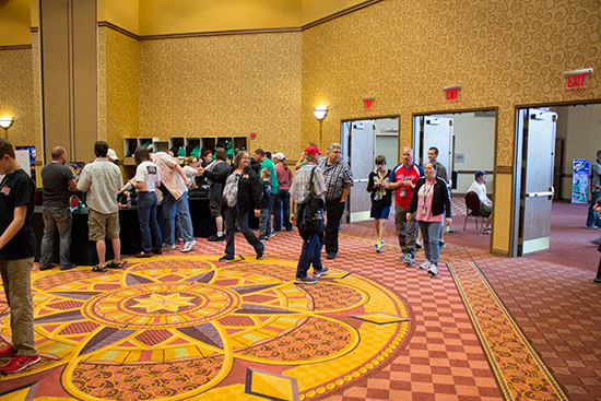 Some of the first visitors enter the show