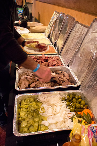 Potato, corn, sausage, beef, turkey, onions, chilies, pickles and bread, all with BBQ sauce