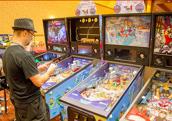 Charlie from Spooky Pinball sets up the two The Jetsons pinballs along with a Rob Zombie and Domino's