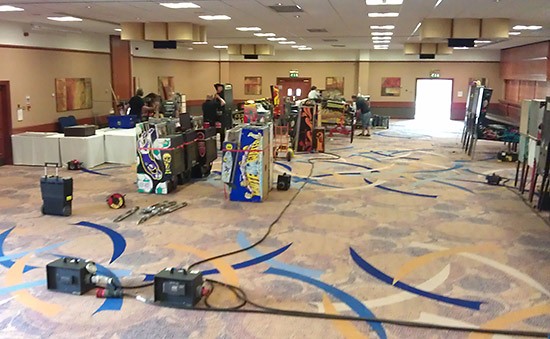 Gradually, the hall begins to fill with machines