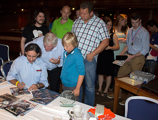 George autographing flyers