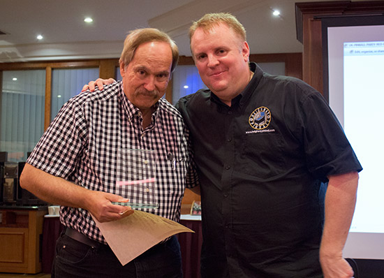 Barry receives his certificate and award from Andrew