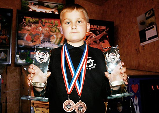 William Moore with his two trophies
