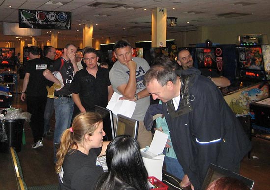 Players collect their player badges, score cards and joker cards