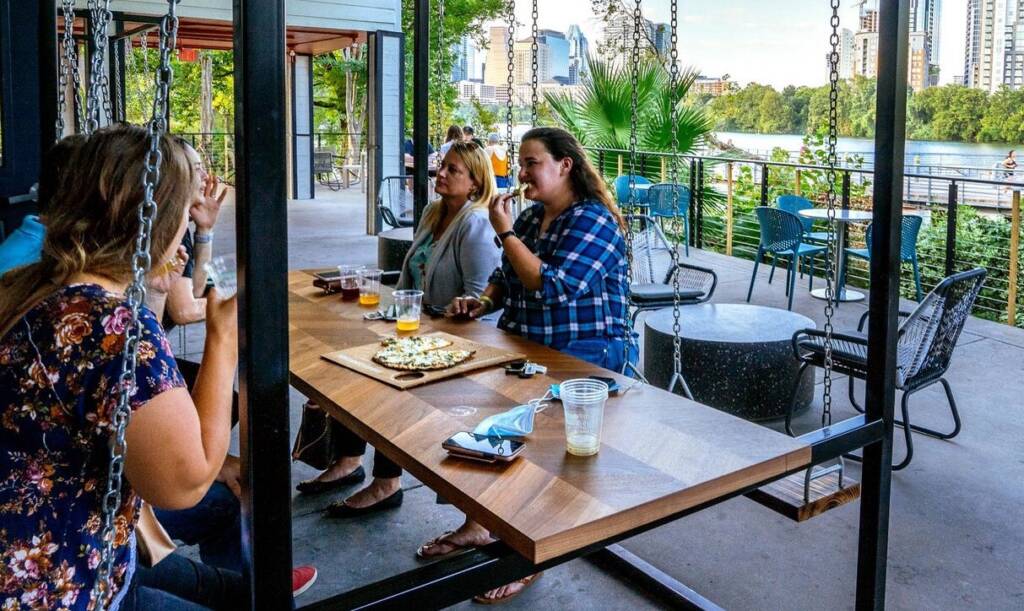 At Cidercade Austin's outdoor seating area, you can enjoy breath-taking views of the Austin skyline - it is also a respite from the gaming frenzy inside