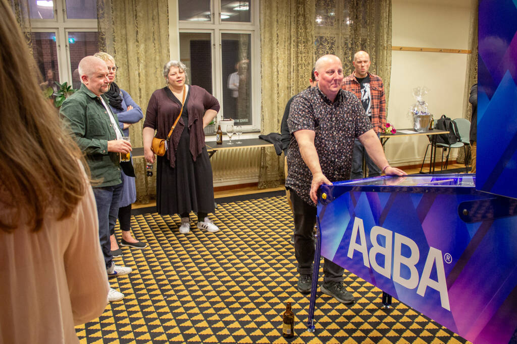 Playing the new ABBA pinball in a quieter side room