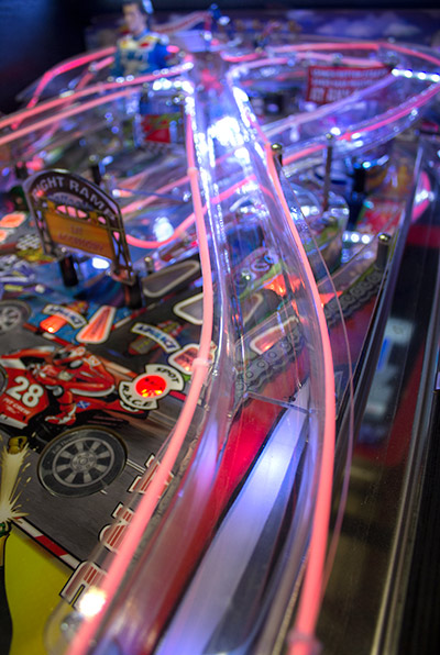 The left ramp crosses to the right side of the playfield
