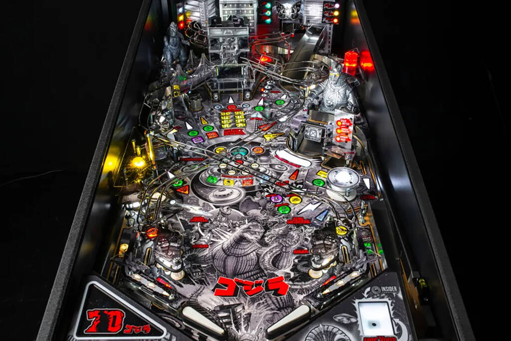 The full playfield with inserts lit
