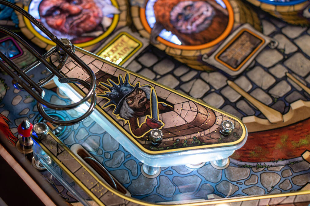 The gold mirrored effect on the playfield plastics
