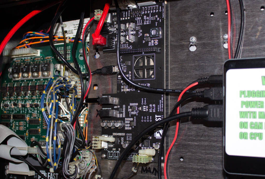 The audio controller board with the two new speaker connectors at the bottom