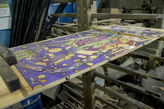 A Ghostbusters playfield cut in four