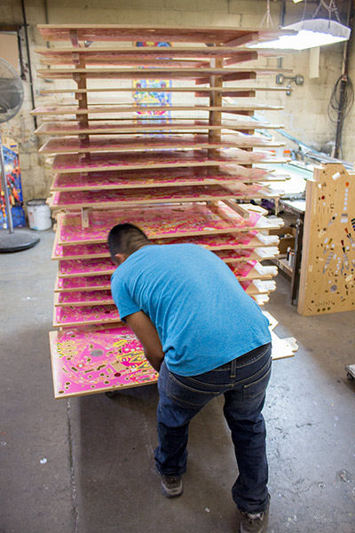 A Ghostbusters playfield with magenta and yellow ink is picked and placed under the screen