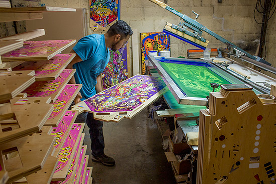 The freshly inked playfield is removed to dry
